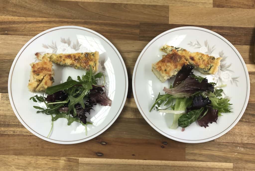 Clockwise from left: French Onion Strata, a bacon, gruyere, and leek quiche, and a salad. 