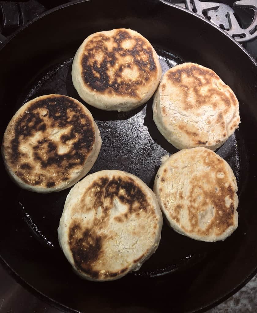 Sourdough English muffins in cast iron skillet