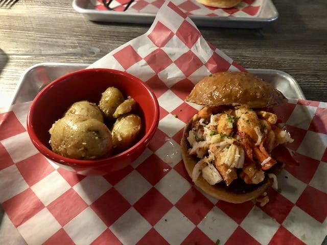 Lobster roll with roasted potatoes