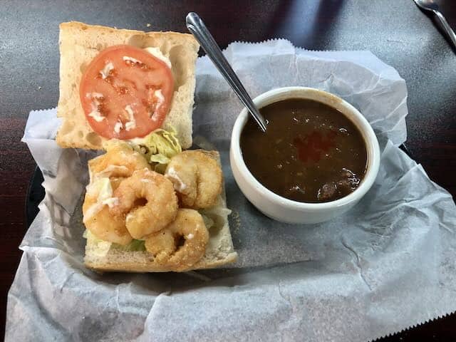 One-half shrimp po'boy and a cup of shrimp and okra gumbo